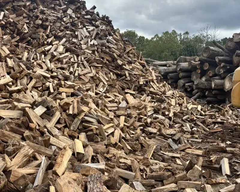 Split firewood piled at the R&R yard