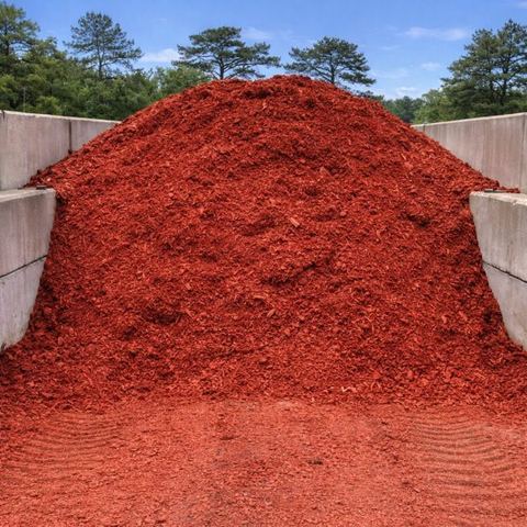 red-dyed mulch pile in a bay